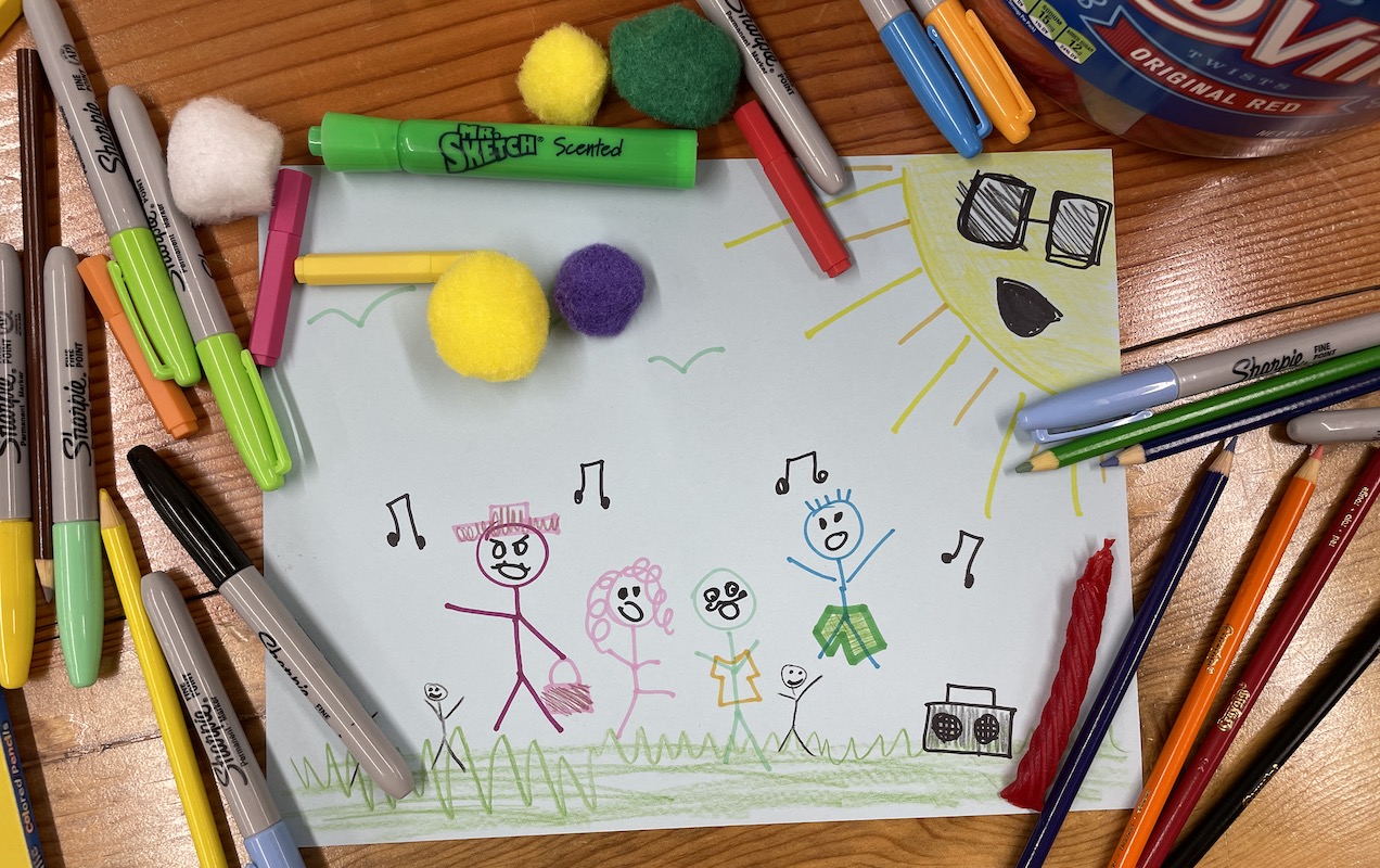 Image shows a child's drawing of summer camp